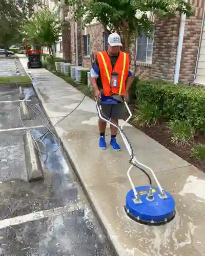 Sidewalk-Cleaning-with-Orange-Vest-400x500 Multi-unit Sidewalk Cleaning